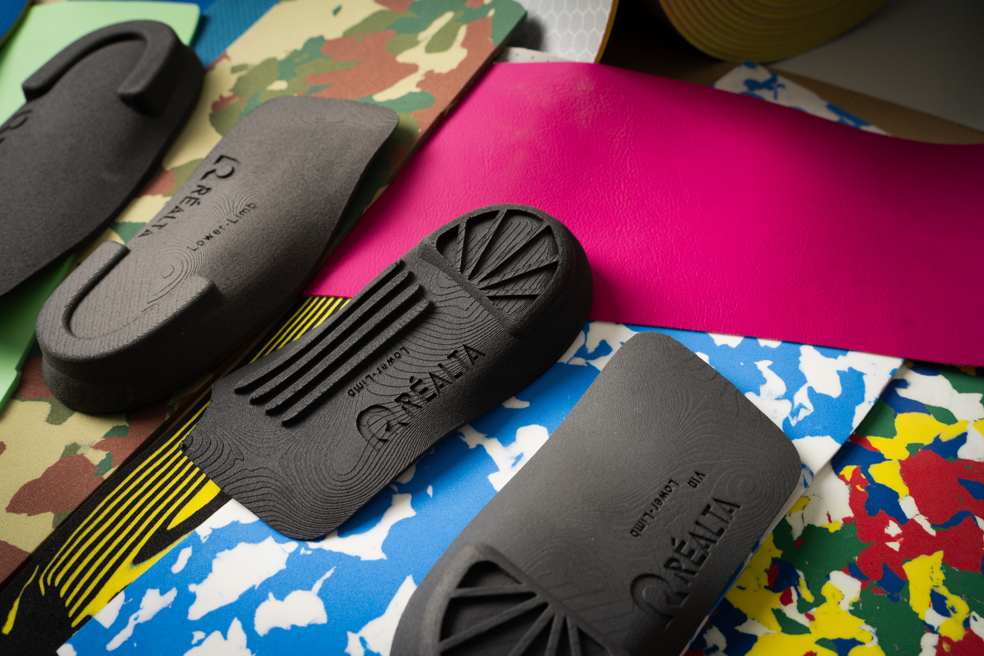 Réalta custom 3D-printed orthotic shells manufactured by Réalta Labs for Lower Limb Clinic Belfast, showing SLS nylon shells with precision lattice structures